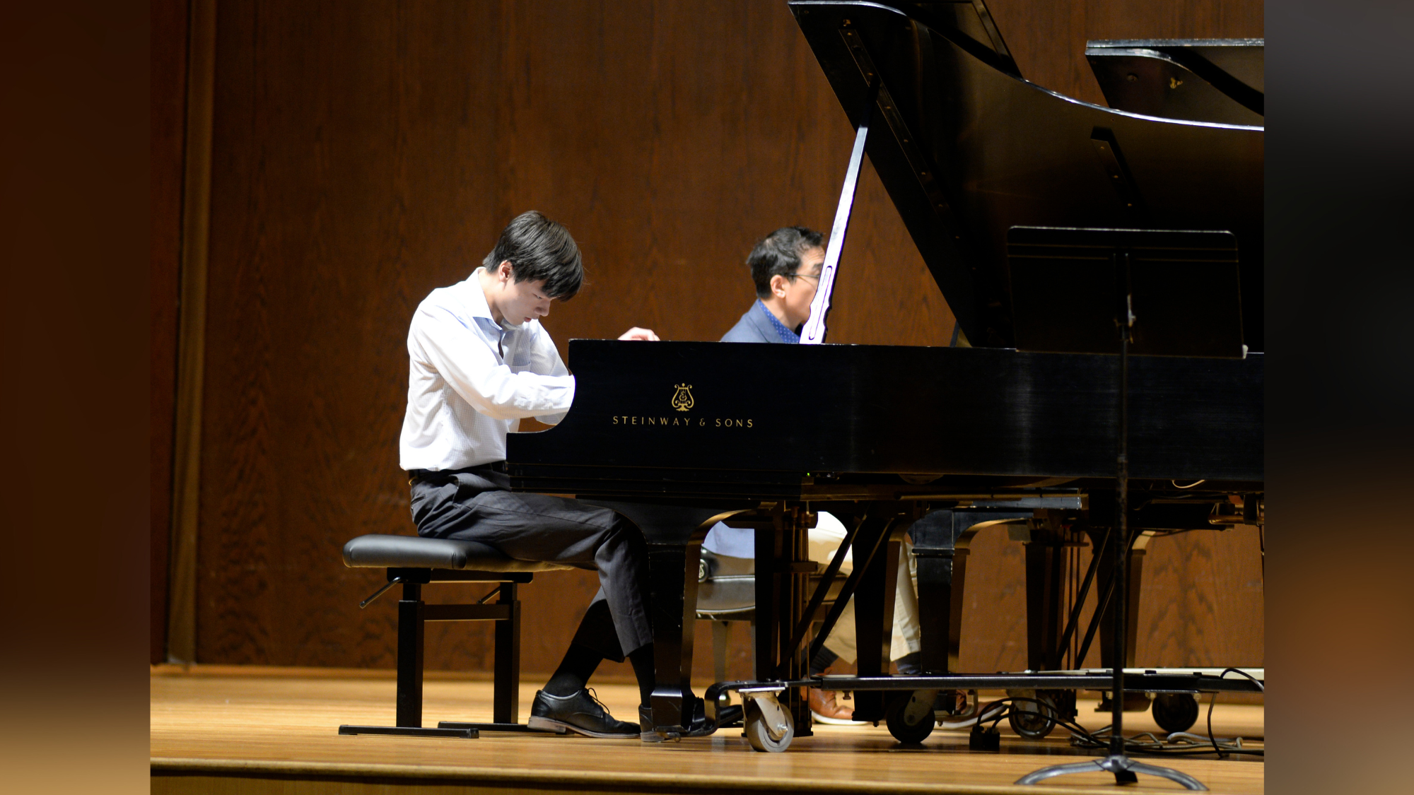 teen boy playing piano